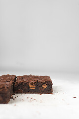 Dark chocolate brownies with caramel on parchment paper