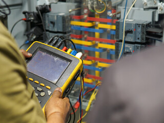 digital multimeter in the hand
