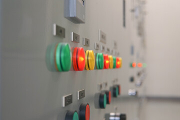 Electrical selector switch,button switch,Electrical switch gear at Low Voltage motor control center cabinet in coal power plant. blurred for background.
