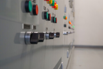 Electrical selector switch,button switch,Electrical switch gear at Low Voltage motor control center cabinet in coal power plant. blurred for background.