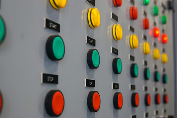 Electrical selector switch,button switch,Electrical switch gear at Low Voltage motor control center cabinet in coal power plant. blurred for background.