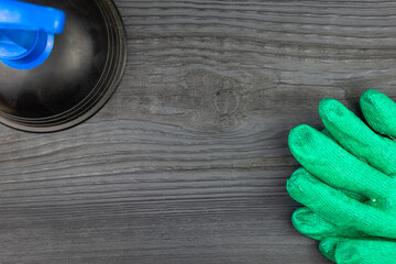 Plunger for removing blockages in pipes and sewers on a dark table background (copy space).