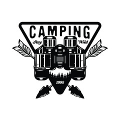 Vintage camping binocular badge design with crossed hunting arrows 
