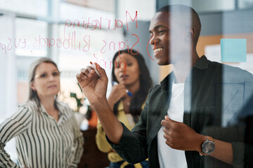 Fototapeta premium Success is never of vicarious nature, work until its yours. Shot of a group of businesspeople brainstorming in a modern office.