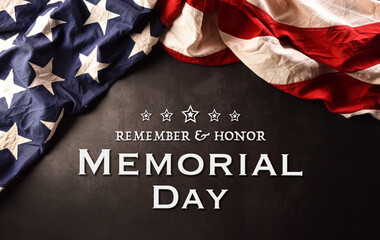 Fototapeta na wymiar Happy memorial day concept made from American flag with the text on dark stone background.