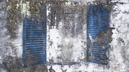 Old Cement wall with faded painted blue shutters background texture