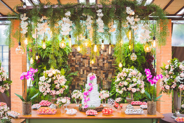 table with decoration and wedding cake