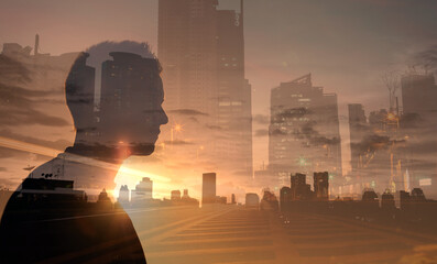 Man with a vision. Young businessman looking out to the city view