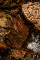 Water Rushing Over Shallow Rocks Below The Surface