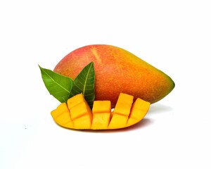 Sweet ripe mango with green leaves on a white background.