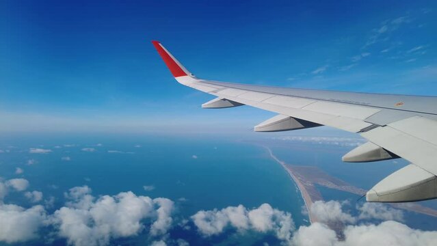 View from airplane flying over sand beach, estuaries and Black sea, Anapa resort, Russia