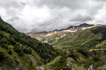 Mountain valley with colorful mountains on a cloudy day, Chile