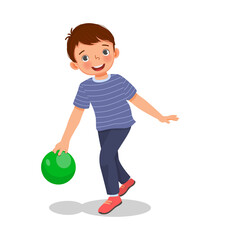 cute little boy playing bowling in the sport club ready to throw the ball