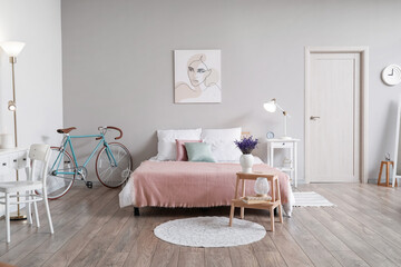 Stylish bedroom interior with bicycle