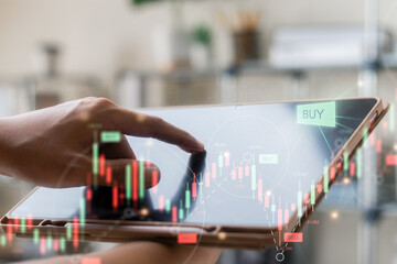 Businessmen work with stock market investments using tablet to analyze trading data. smartphone with stock exchange graph on screen. Financial stock market.