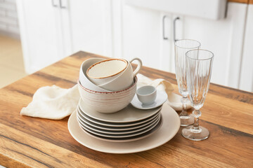 Set of clean tableware in kitchen