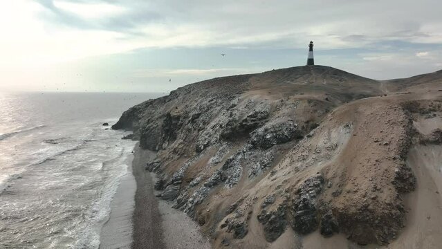 Aerial view of the cliffs and the lighthouse of Puerto Eten, Lambayeque, Peru.
