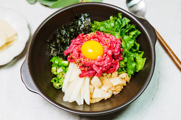 Yukhoebibimbap, Korean style Beef Tartare Bibimbap : This is a bowl of rice topped with seasonal namul (seasoned vegetables) and fresh yukhoe (chopped raw beef) and served with seasoning. Lean fresh r
