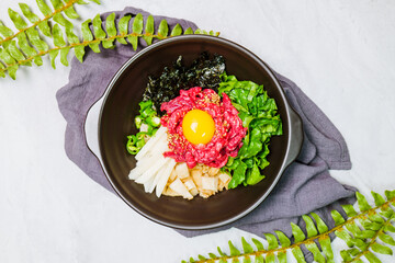 Yukhoebibimbap, Korean style Beef Tartare Bibimbap : This is a bowl of rice topped with seasonal namul (seasoned vegetables) and fresh yukhoe (chopped raw beef) and served with seasoning. Lean fresh r