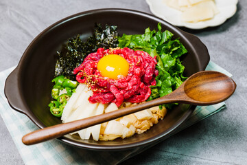 Yukhoebibimbap, Korean style Beef Tartare Bibimbap : This is a bowl of rice topped with seasonal namul (seasoned vegetables) and fresh yukhoe (chopped raw beef) and served with seasoning. Lean fresh r