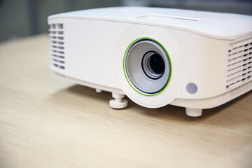 Close-up computer projector on table boardroom or meeting room technology equipment of visual or...