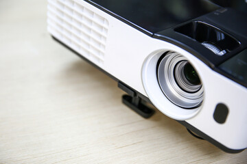 Close-up computer projector on table boardroom or meeting room technology equipment of visual or...