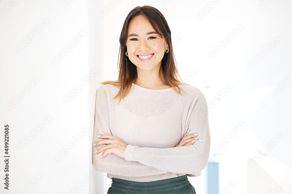 Canvas Prints Paving the way to success. Shot of an attractive young businesswoman standing alone in the office with her arms folded.