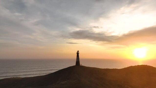 Magical sunset in a lighthouse, the cliffs with sea birds. Puerto Eten at sunset, Lambayeque, Peru