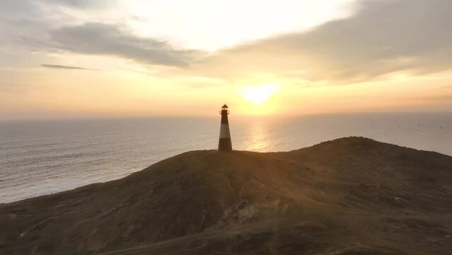 Magical sunset in a lighthouse, the cliffs with sea birds. Puerto Eten at sunset, Lambayeque, Peru