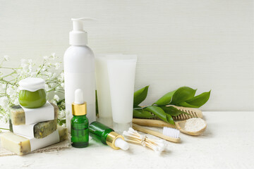 Eco cosmetic products for skin care of face and body. White tubes with natural creams, soap, and bottle with essence oil, and other cosmetic products with minerals, vitamins, prebiotics