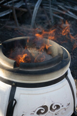 Tandoor  is a special spherical or pitcher-shaped grill or roaster made of clay for cooking various food. 