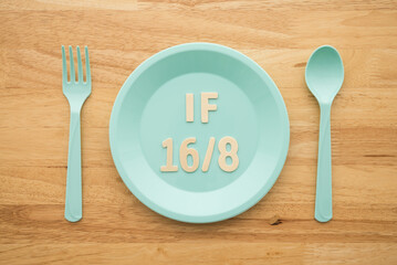 IF (Intermittent Fasting) 16 and 8 diet rule and weight loss concept. IF 16 and 8 letter on blue...