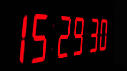 Digital timer on a black background. Light panel with red numbers - obrazy, fototapety, plakaty