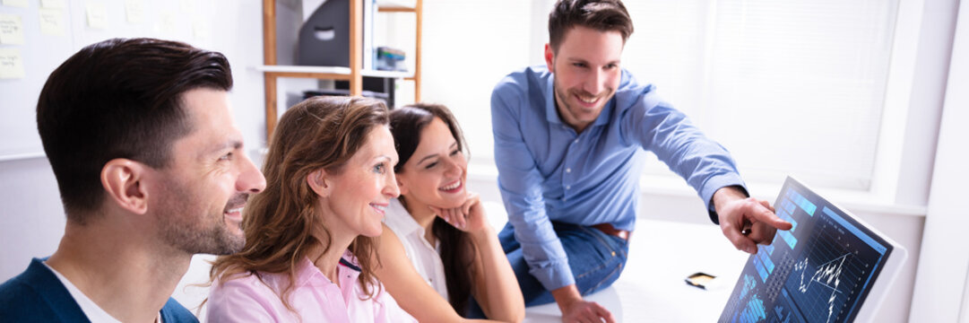 Happy Businesspeople Stock Market Broker Analyzing Graph - Powered by Adobe