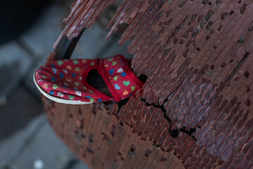 Kids shoes on representing civilian casualties in an active war zone