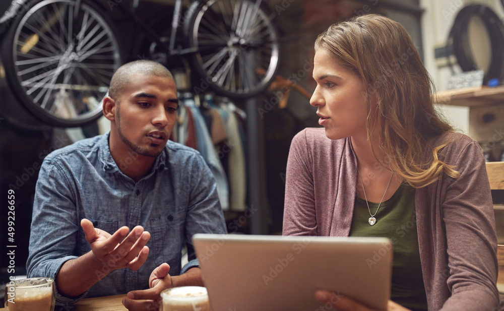Poster plotting the strategy for small business success. shot of a young man and woman using a digital tabl