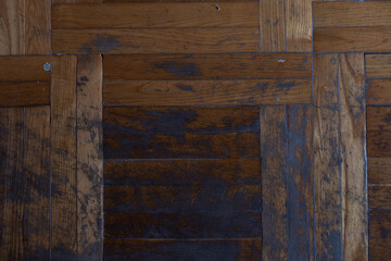 Texture of old worn parquet floor, close up