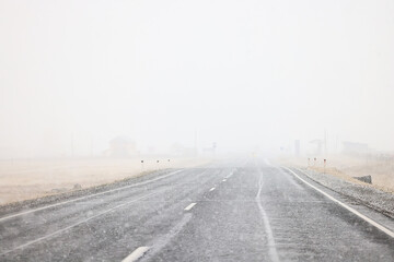 winter highway snowfall background fog poor visibility