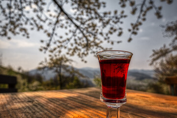 glass of red wine on a wooden table