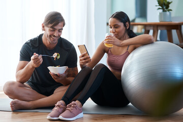 After workout snacks. Full length shot of an athletic young couple enjoying some healthy snacks...