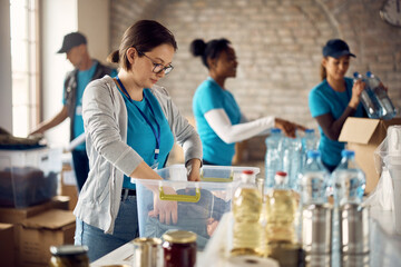 Young woman volunteering at charitable foundation.