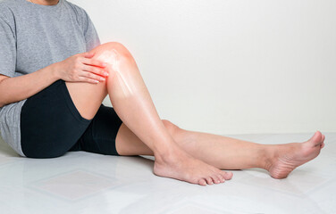 Human leg osteoarthritis inflammation of bone joints on white background