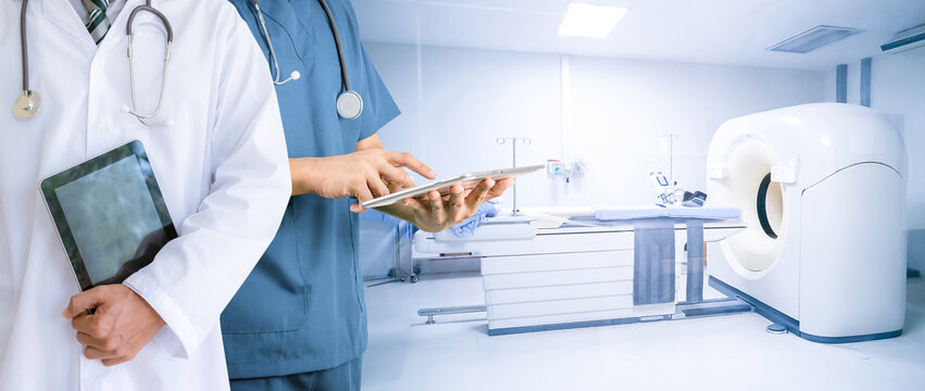 Doctor holding a tablet medical concept Computer X-ray CT scan in hospital - Powered by Adobe