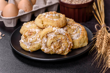 Homemade glazed puff pastry cinnamon rolls with custard and raisins