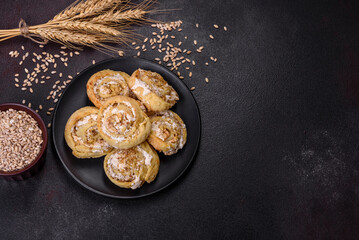 Homemade glazed puff pastry cinnamon rolls with custard and raisins