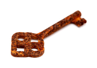 Old very rusty key isolated on white background 