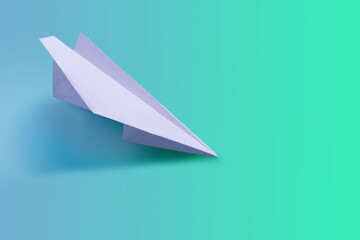 Naklejka premium Paper airplane on a tone-harmonious background, toned