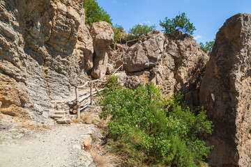 Golitsyn trail on a sunny day. Summer Crimean landscape with stairway