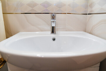 the white sink in the bathroom. comfortable