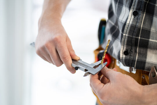Master measuring drill diameter using calipers in light workshop - Powered by Adobe
